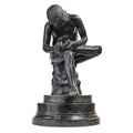 Sculpture in Bronze and Marble inspired by the Spinario